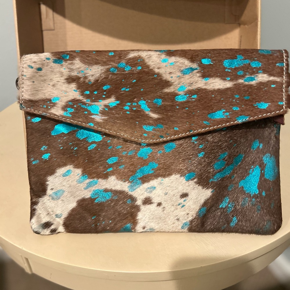 American Darling leather Cowhair clutch.  Brown and cream cowhide/blue accents.